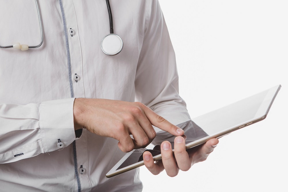 doctor working on tablet