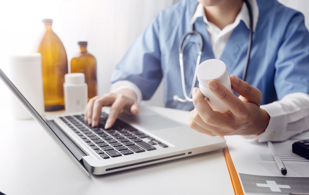 doctor holding a box of medicine