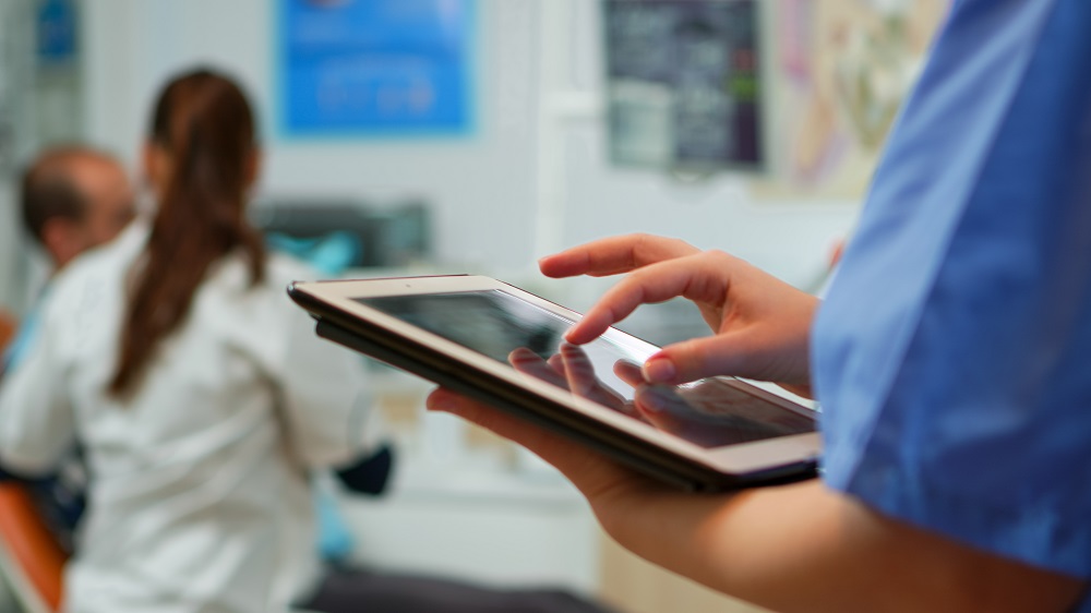 nurse using tablet